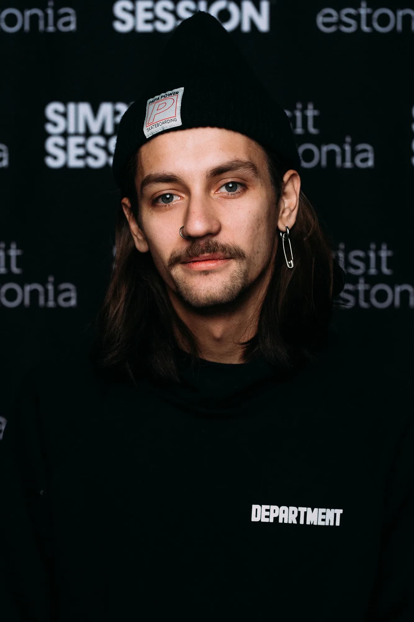Portrait of skateboarding coach Yurii Korotun in a beanie at a Simple Session event